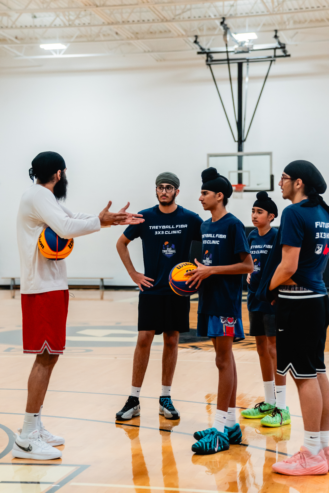 Treyball head coach breaking down a teaching moment with players at a FIBA 3x3 clinic